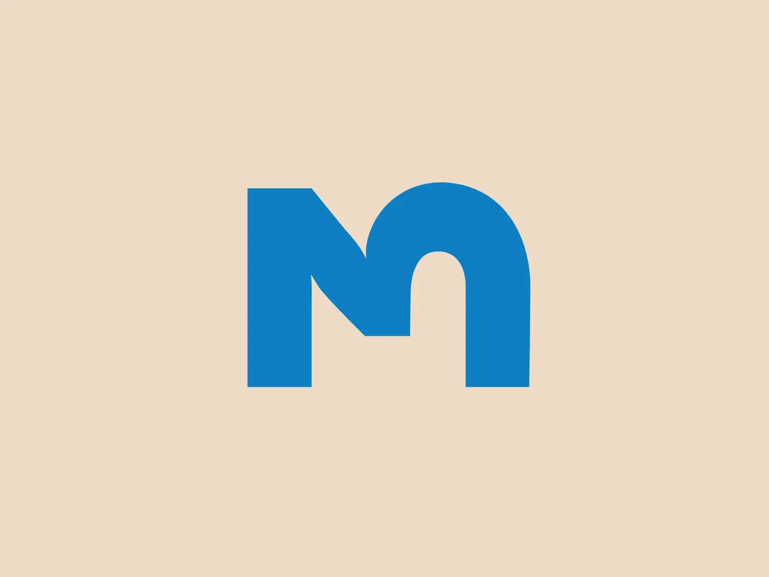 The Campus Montréal logo is a stylized letter 'M' with a modern and minimalist aesthetic. It features bold, clean lines and is comprised of two vertical bars connected by a curved bridge at the top, suggesting a continuous path or an arch. The logo has a solid, flat color which is a vibrant shade of blue that stands out for its simplicity and professional appearance. There are no additional embellishments or textures, highlighting a sleek and contemporary design that is versatile for various branding purposes.