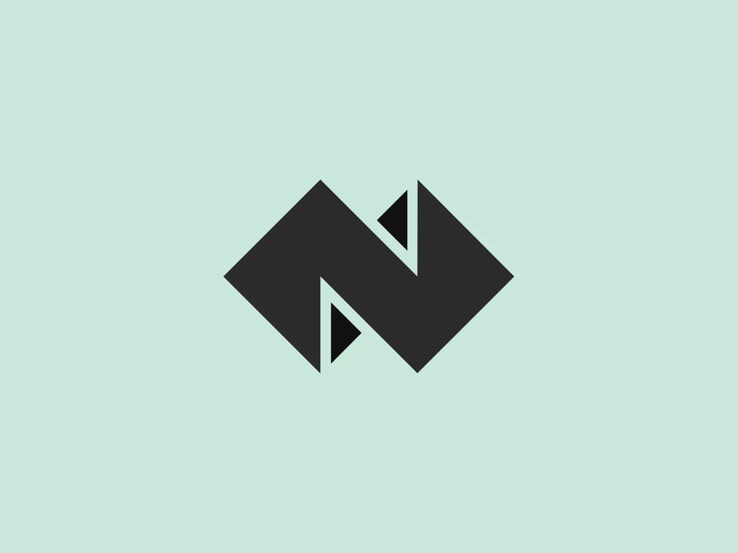 The Nordkalk logo features an abstract design with a modern aesthetic. It combines geometric shapes to form a stylized letter "N." A deep green chevron points upwards and to the right, symbolizing motion and progress. Lighter blue triangles on the left and right arms add depth and a three-dimensional effect to the logo, creating a dynamic and professional appearance.