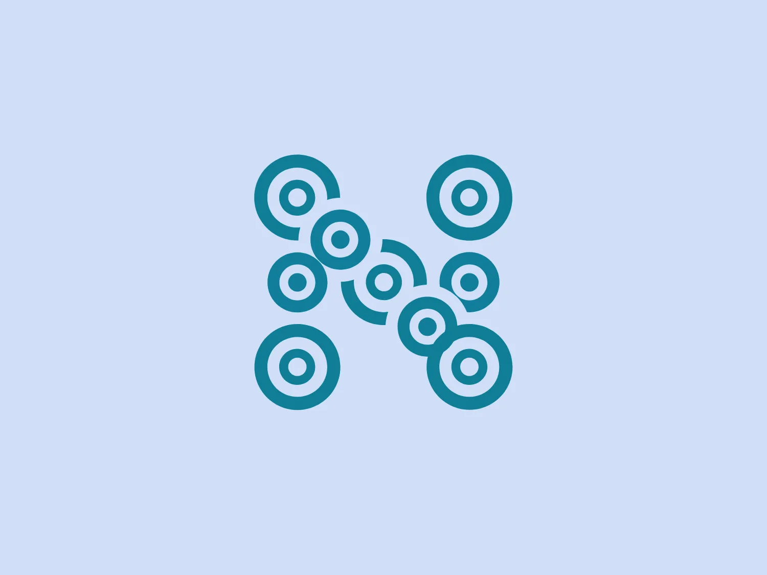 The NEAnderLab logo features a symmetrical pattern of interconnected circles. There are eight circles, each one containing a smaller filled circle centered within a larger ring, evoking the aesthetic of modern, minimalistic design. The circles are arranged in a diagonal cross shape, with four arms extending outward from a central point. This creates an X-like structure with a clear, balanced geometry. The NEAnderLab logo uses a singular color, a bright shade of turquoise, against a white background, giving it a fresh and vibrant feel. The use of negative space within and around the shapes enhances the logo’s visual appeal, making it both simple and intriguing.