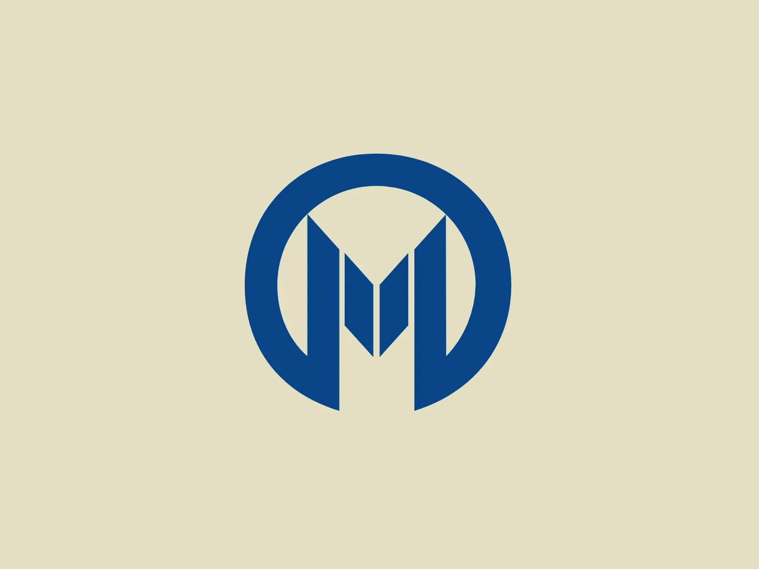 The logo features a stylized letter "M" centrally placed within an encompassing circular border. It consists of sharp lines and geometric shapes, using a deep and vivid shade of blue. The "M" is designed with symmetry in mind, with the vertical lines connected by a pointed, inverted "V" shape at the base. The simplicity of the design gives it a modern and professional appearance. The clean lines and use of negative space grant the logo an easily recognizable and memorable quality.