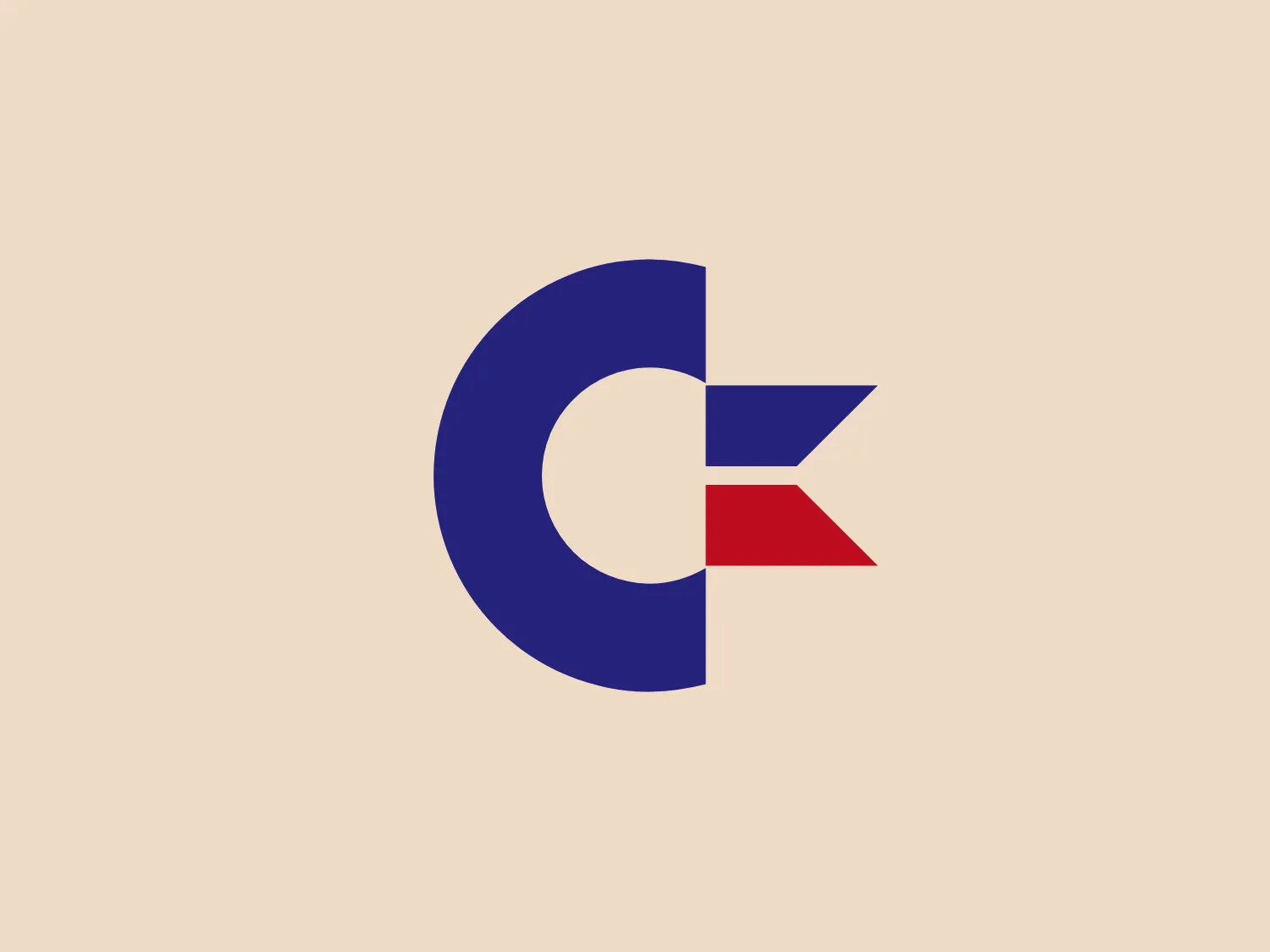 The Commodore logo features a large, bold, blue letter "C" that encircles a smaller red shape resembling a right-pointing arrow or a play button symbol. The stark contrast between the blue and red hues creates a striking and modern aesthetic. The absence of additional elements or embellishments underscores a commitment to clarity and efficiency in the design, striking a balance between visual impact and straightforward symbolism.