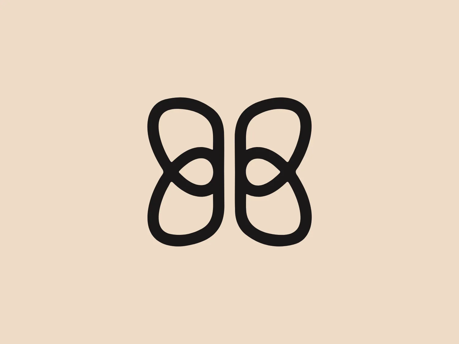 The image displays a stylized logo consisting of two identical, interconnected abstract shapes that mirror each other. The shapes resemble a combination of the number "8" and the infinity symbol, with a fluid, continuous line that twists around itself, creating a balanced and harmonious form. The Honeylove logo is black, which contrasts sharply with a white background, presenting a minimalistic and modern aesthetic. Each shape appears to have a round body with an elongated upper loop, suggesting a sense of movement and interconnectivity. The overall design is sleek, clean, and devoid of any additional embellishments, focusing on the symmetry and elegance of the intertwined forms.
