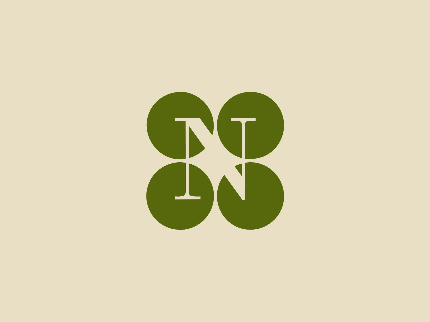 Napa Valley Vintners Logo description: The logo features a unique arrangement of four overlapping circles in a muted green color, forming a clover-like shape. Within the negative space where the circles intersect, a white, stylized "N" is prominently displayed, connecting to an inverted "V" or chevron shape that suggests movement or progress. The design aesthetic is minimalistic and contemporary, with a focus on clean lines and geometric symmetry. The simplicity of the shapes and the bold contrast between the green and white allow the Napa Valley Vintners initials or symbol within to stand out distinctly.