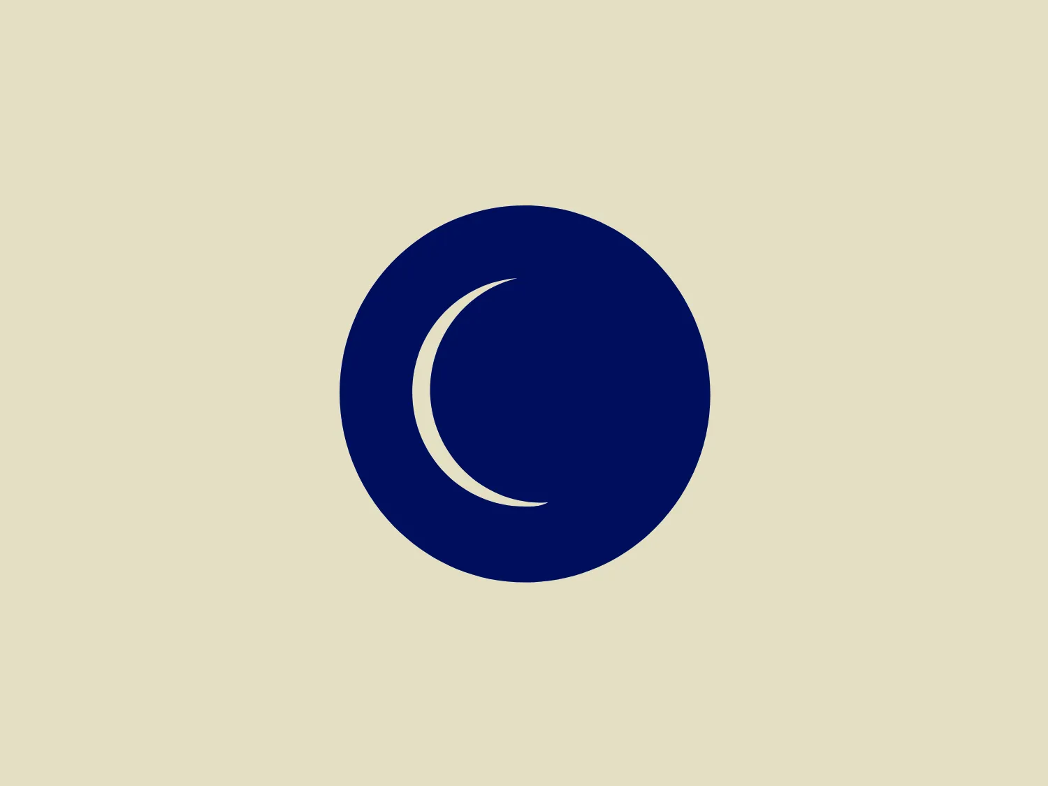 The Ozo Hotels logo features a minimalist design with a deep navy blue color. Central to the design is a stylized crescent moon that sits inside a perfect circle, creating a sense of harmony and balance. The crescent moon is to the left of the circle's center, giving the design a dynamic asymmetry. The simplicity of the design, consisting of just the circle and crescent shape, exudes elegance and modernity. The logo's clean lines and lack of additional embellishments suggest it could be for a brand valuing sophistication and clarity. Given the simplicity and color palette of the logo, a light and neutral background would complement it well.