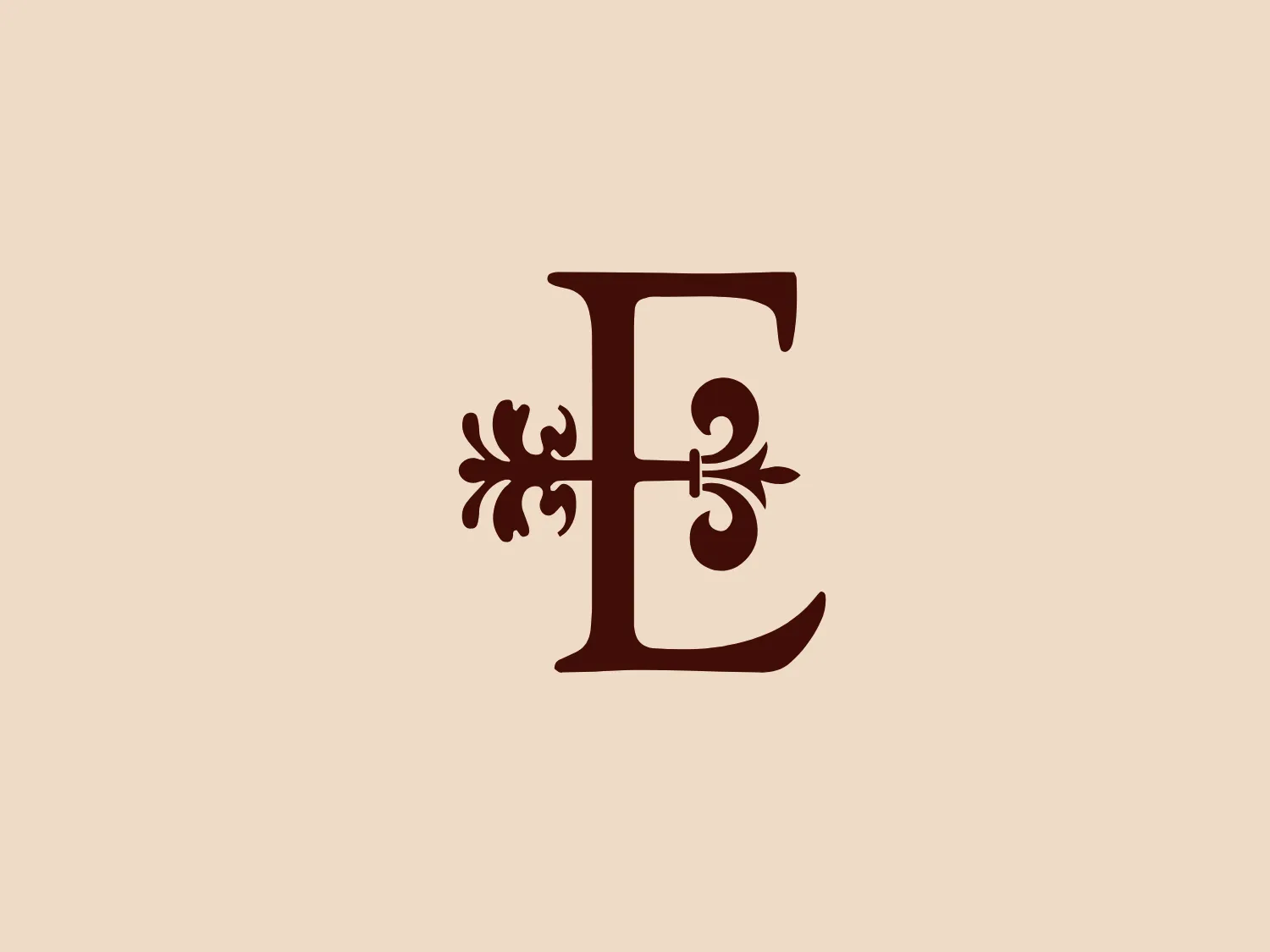 The Escondido logo features an elegant letter "E" in a rich, dark brown color that resembles the shade of well-polished mahogany. The letter showcases an ornamental design that gives it a vintage and sophisticated look, with swirls and a floral motif that extend from its central axis. These decorative elements add an artistic flourish to the letter, suggesting a sense of luxury and refinement in the brand it represents. The serif on the letter is stylized, which complements the overall antique aesthetic of the design.