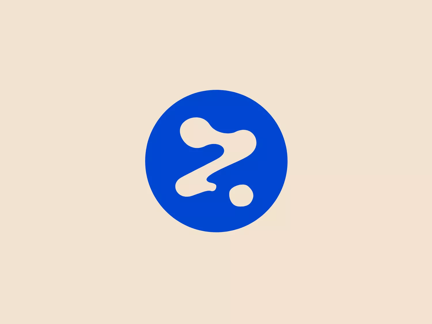 The Rezdy logo is a simple yet bold design, featuring a white stylized question mark at the center of a deep blue circular background. The question mark itself has an abstract and modern twist, with elongated curves and a dynamic shape, giving a sense of fluidity and motion. There are splashes or drops of white that are detached from the main body of the question mark, adding an element of playfulness and creativity to the design. The color contrast is stark and eye-catching, with the bright white against the rich blue creating a strong visual impact.