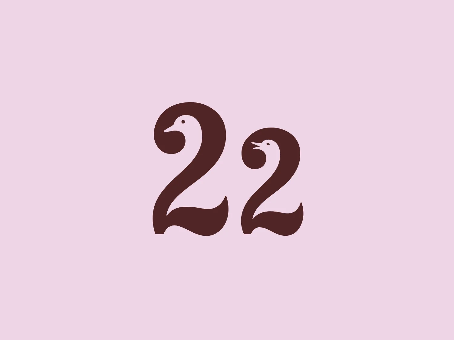 The 22 Street Lane Nursery logo consists of a stylized depiction of the number '22', resembling serpents or snakes. The deep brown numerals are minimalistic yet playful, with curved tops resembling snake heads, complete with tongues and eyes. The smooth, symmetrical lines and bold width of the numerals give the logo a strong presence.