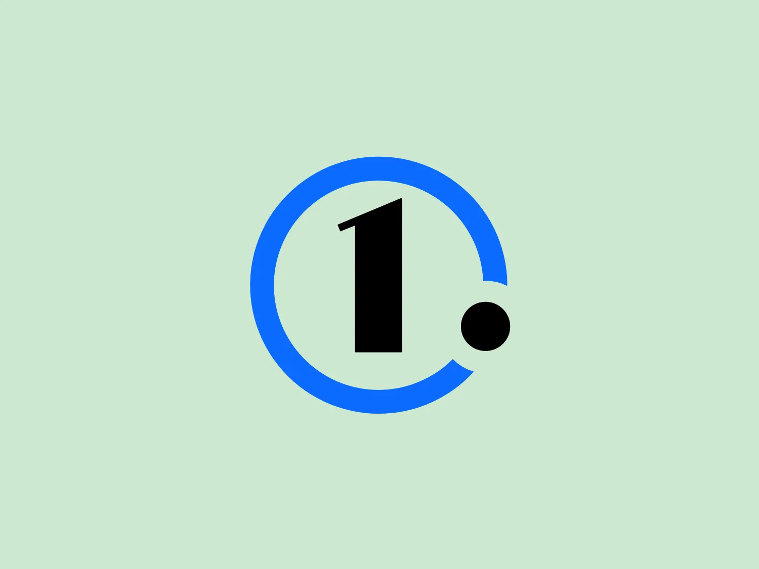 The Motor1 logo features a bold and simple design, consisting of a large, dark blue circle that frames a stylized number "1" in black. To the right of the "1", there is a small black dot that appears to be orbiting it, adding a dynamic element to the design. The number itself has a modern sans-serif font, giving the logo a contemporary and clean aesthetic. The use of a limited color palette with high contrast between the dark blue, black, and white space emphasizes clarity and visibility.