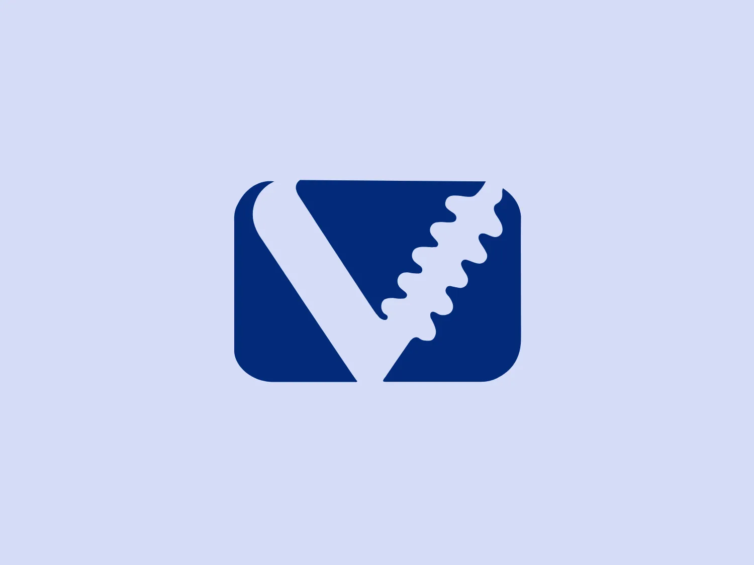 The Voltrak logo is a stylized, abstract shape enclosed within a rounded rectangle. The primary element is a deep blue, almost navy color. Within this rectangle, there is a diagonally placed element that resembles a serrated edge or perhaps a stylized leaf with notches. The split created by this serrated line divides the rectangle into two different shades of blue, with the darker shade occupying the left side and a slightly lighter shade on the right. The contrast between the two shades is subtle yet provides depth and dimension to the design. The logo has a clean, modern feel with its bold color and simple geometric shapes.