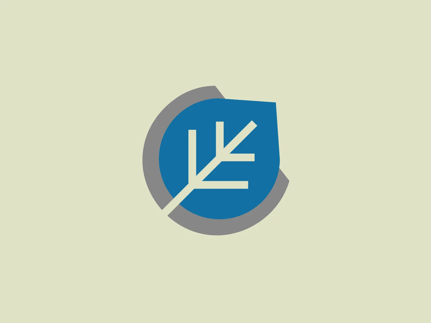 The logo for Creative Therapy features a modern and minimalist design consisting of a stylized tree or plant with branches, rendered in white, which is set against a solid blue shield shape. The shield is partially overlapped by a circular grey shape, suggesting dimensional layering. The blue is vibrant and contrasts well with the white and grey, giving the logo a professional and crisp appearance. The aesthetic is clean and straightforward with a tech or environmental vibe suggested by the choice of the tree-like iconography.