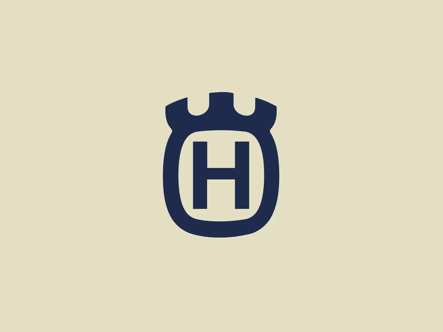 The Husqvarna logo features a bold, uppercase "H" centrally placed within a stylized shield-like shape. The shield has a flat bottom with three distinct cutouts at the top, suggesting a fortified or protected theme often associated with crests or emblems. The design uses a monochromatic color scheme with a deep navy blue. The overall aesthetic of the Husqvarna logo is modern and minimalist, with a strong sense of stability and security conveyed through the use of thick lines and the imposing letterform.